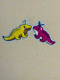 Two cartoon-style lizards, one yellow and one purple, facing each other on a beige background.