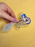Hand holding a transparentsticker of Sticker of Jinx from Arcane and League of Legends on a yellow background
