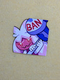 Cartoon character with a hammer labeled 'BAN' on a beige background